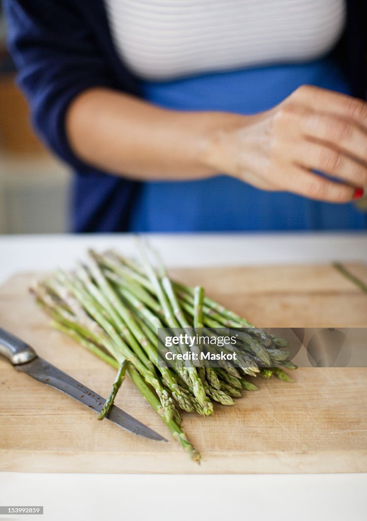 Close-up of asparagus on cutting board