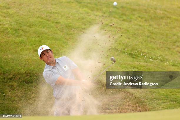 Byeong Hun An of South Korea plays a bunker shot for his 2nd shot on the 6th hole during Day One of the Genesis Scottish Open at The Renaissance Club...