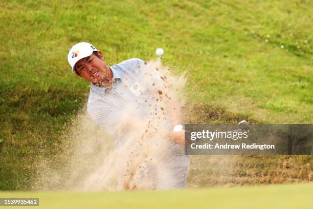 Byeong Hun An of South Korea plays a bunker shot for his 2nd shot on the 6th hole during Day One of the Genesis Scottish Open at The Renaissance Club...