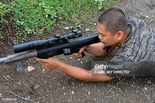 To go with AFP story "Philippines-unrest-Muslims-MILF-peace-arms,FOCUS" by Jason Gutierrez This photo taken on October 10, 2012 shows Guiazakallaha...