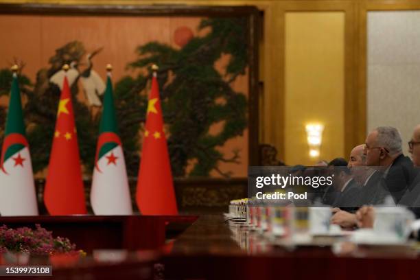 Algerian President Abdelmadjid Tebboune speaks with Chinese President Xi Jinping during a meeting at the Great Hall of the People on July 18, 2023 in...