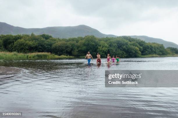 family open water swimming together - 17 loch stock pictures, royalty-free photos & images