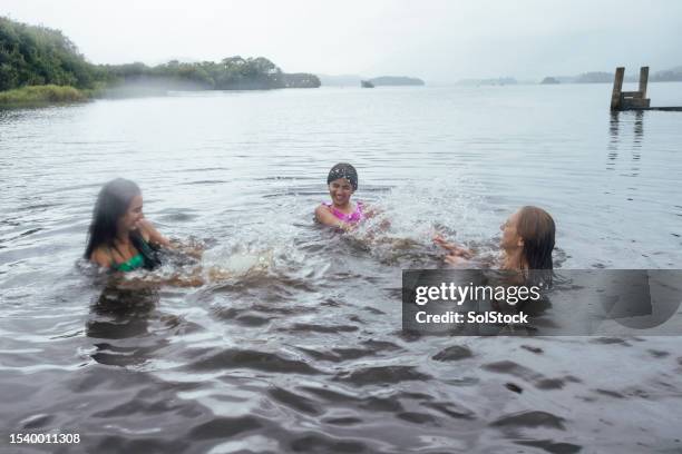 mother and daughters wild swimming - 17 loch stock pictures, royalty-free photos & images