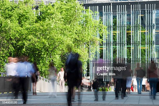 office workers walking in financial district, blurred motion, paris, france - trång kostym bildbanksfoton och bilder