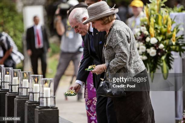 Former Prime Minister John Howard and Janette Howard lay flowers in rememberance during the Bali Bombing 10th anniversary memorial service at Garuda...