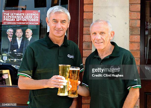 Ian Rush and Peter Reid pose for photos during the Carlsberg Ultimate Legends Pub Experience at The Crown pub on October 12, 2012 in Lichfield,...