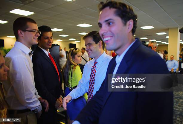 Craig Romney the son of Republican presidential candidate, former Massachusetts Gov. Mitt Romney and Sen. Marco Rubio greet people during a Mitt...