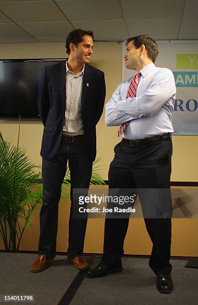 Craig Romney the son of Republican presidential candidate, former Massachusetts Gov. Mitt Romney and Sen. Marco Rubio stand together at a campaign...