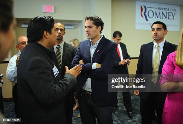 Craig Romney the son of Republican presidential candidate, former Massachusetts Gov. Mitt Romney greets people at a campaign rally for his father at...