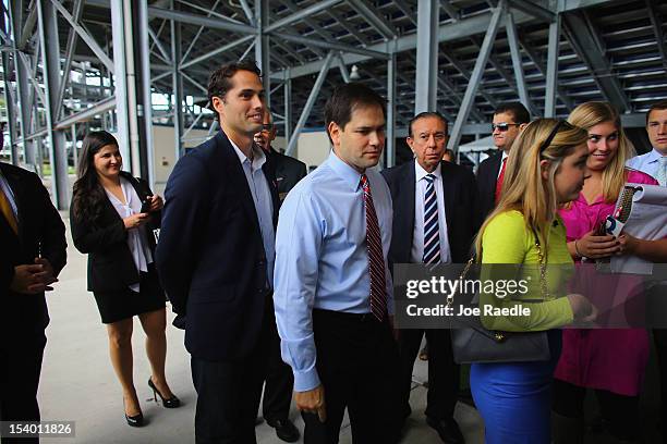 Craig Romney the son of Republican presidential candidate, former Massachusetts Gov. Mitt Romney and Sen. Marco Rubio wait together to enter a...