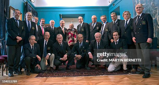 Chilean President Sebastian Pinera poses Chilean mule driver Sergio Catalan , who found the 16 Uruguayan survivors of an airplane crash in the...