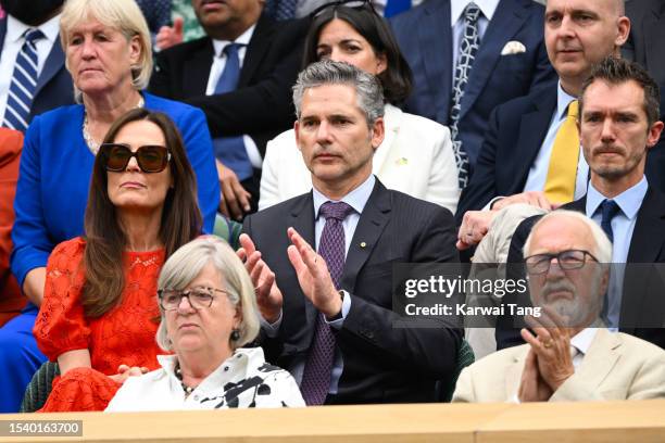 Eric Bana, Rebecca Gleeson and James Whishaw applaud as they attend day eleven of the Wimbledon Tennis Championships at All England Lawn Tennis and...