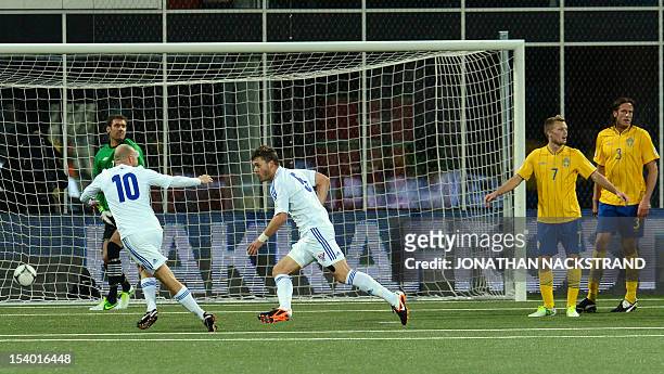 Faroe's defender Rogvi Baldvinsson celebrates as he scores during the FIFA 2014 World Cup qualifier football match Faroe Islands vs Sweden in...