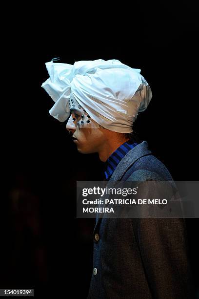 Model displays a Spring/Summer 2013 creation by Portuguese fashion designer Alexandra Moura during the 39th Edition of Moda Lisboa at Patio da Gale,...