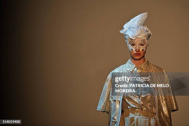 Model displays a Spring/Summer 2013 creation by Portuguese fashion designer Alexandra Moura during the 39th Edition of Moda Lisboa at Patio da Gale,...