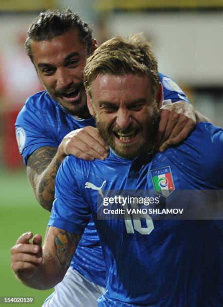 Italy's national football team striker Pablo Osvaldo and midfielder Daniele De Rossi celebrate during the FIFA World Cup 2014 qualifier match between...