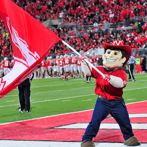 Mascot Herbie Husker of the Nebraska Cornhuskers cheers on the field during a game between the Ohio State Buckeyes and Nebraska Cornhuskers at Ohio...