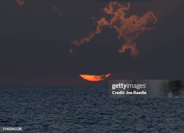 The sunrises over the Atlantic Ocean on July 13, 2023 in Miami Beach, Florida. With triple-digit heat indices over South Florida, the surface ocean...