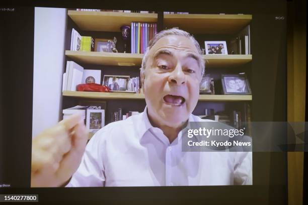 Former Nissan Motor Co. Chairman Carlos Ghosn , who fled Japan in December 2019 while awaiting trial, attends a press conference online, held at the...