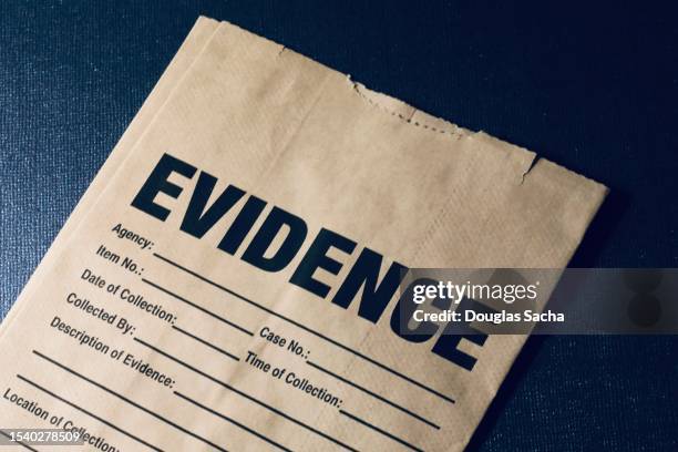 crime scene paper bag for investigation clues - schaamhaar stockfoto's en -beelden