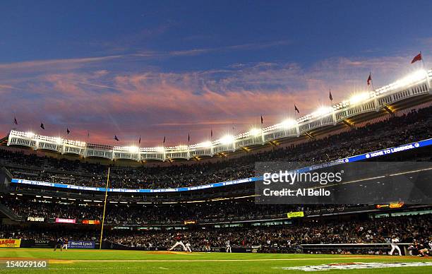 Jason Hammel of the Baltimore Orioles pitches against Nick Swisher of the New York Yankees during Game Five of the American League Division Series at...