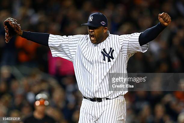 Sabathia of the New York Yankees reacts after getting out of the eighth inning against the Baltimore Orioles during Game Five of the American League...