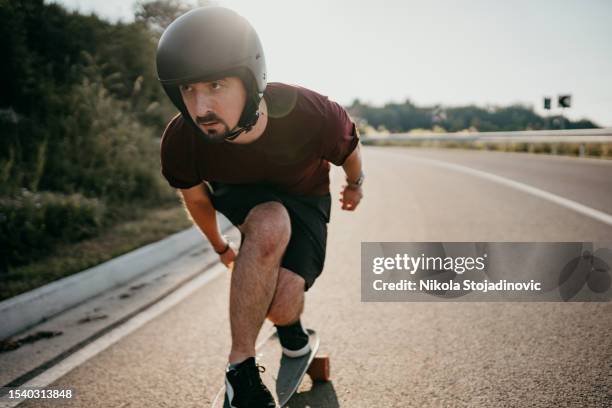 near the highway is meadow from where you can watch beautiful sunset - electric skateboard stock pictures, royalty-free photos & images