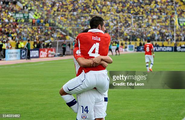 Matias Ferandez and Mauricio Isla celebrate a goal during a match between Ecuador and Chile as part of the South American Qualifiers for the FIFA...