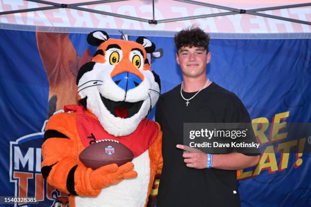 Tony the Tiger and Drew Allar attend Kellogg's Frosted Flakes Mission Tiger event on July 12, 2023 in Bellefonte, Pennsylvania.