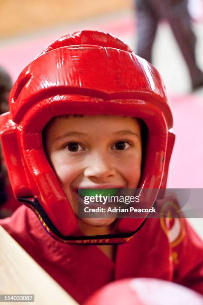 boy in karate headgear - gum shield stock pictures, royalty-free photos & images