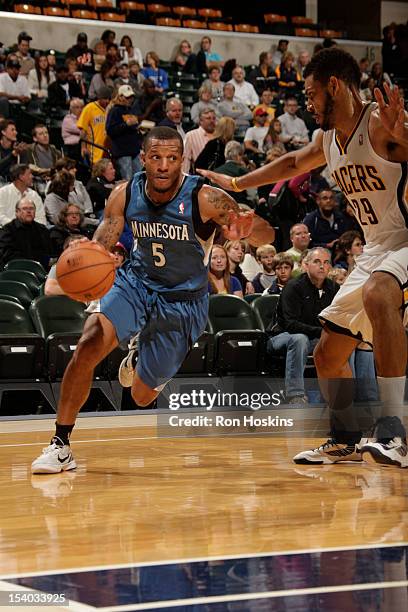 Will Conroy of the Minnesota Timberwolves drives baseline against Jeff Pendergraph of the Indiana Pacers on October 12, 2012 at Bankers Life...