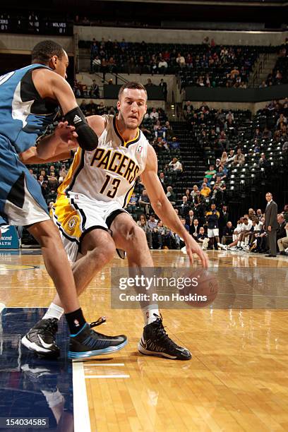 Miles Plumlee of the Indiana Pacers handles the ball against the Minnesota Timberwolves on October 12, 2012 at Bankers Life Fieldhouse in...