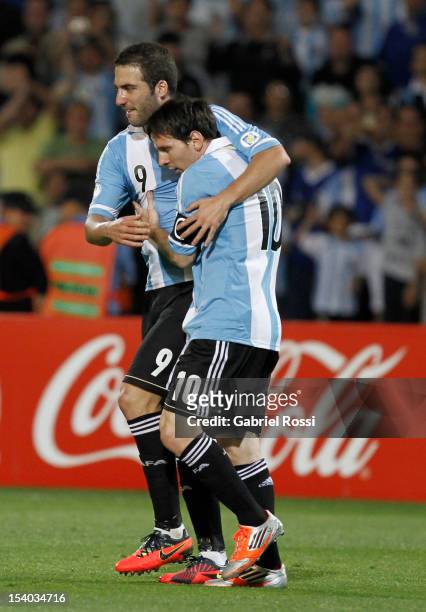 Lionel Messi and Gonzalo Higuain of Argentina celebrates a goal during a match between Argentina and Uruguay as part of the South American Qualifiers...