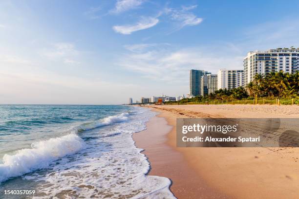 ocean wave at miami beach on a sunny day with blue sky, miami, florida, usa - miami imagens e fotografias de stock