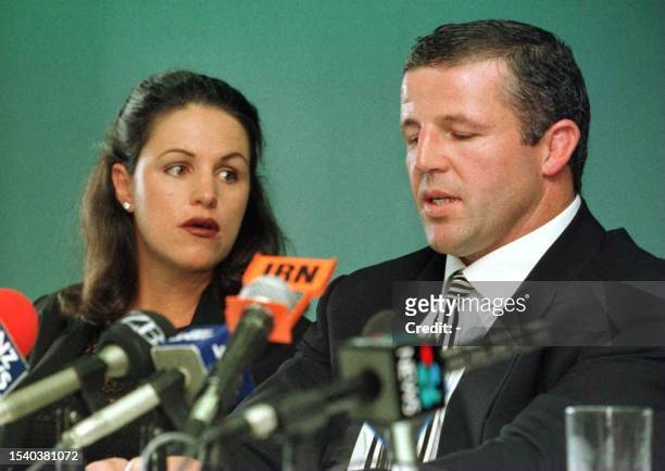 With his wife Bronwyn looking on, All Black captain and hooker Sean Fitzpatrick announces his retirement from all levels of rugby in Auckland, New...