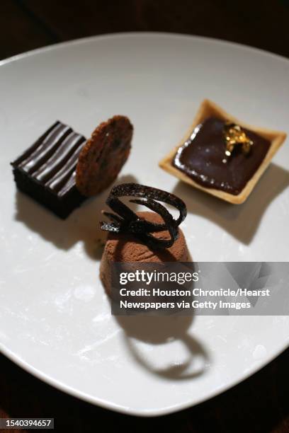 Milk Chocolate and Almond Souffle, Devil's Food Cake and Chocolate Pot de Creme Tart made by Chef Jimmy MacMillan Thursday at the at the Houstonian...