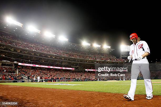 Jayson Werth of the Washington Nationals walks back to the dugout after flying out to right field in the ninth inning against the St. Louis Cardinals...