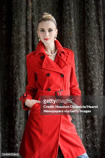 Irina Shyshkina of the Neal Hamil Agency wears Feraud's red velvet trench coat, $1,415 at Esther Wolf, with Mariquita Masterson's earrings, $330, and...