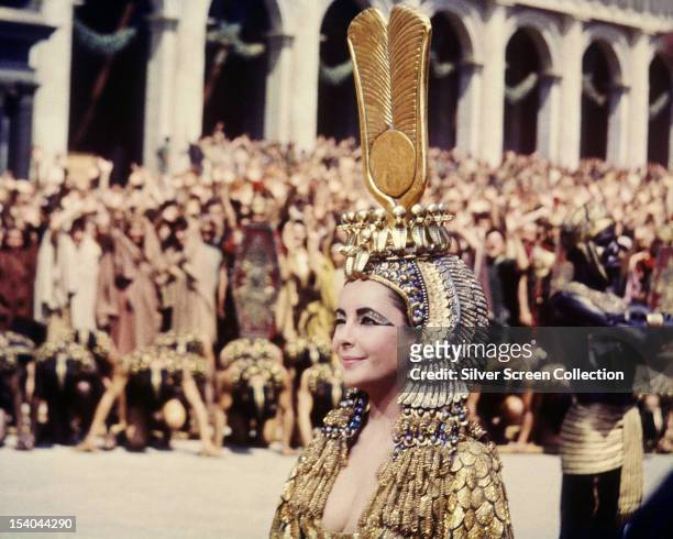British-born American actress Elizabeth Taylor winking in the title role of 'Cleopatra', directed by Joseph L Mankiewicz, 1963.