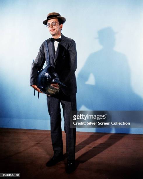 American comic actor Don Knotts as Henry Limpet, holding a stuffed swordfish, in the live-action/animated film 'The Incredible Mr Limpet', directed...