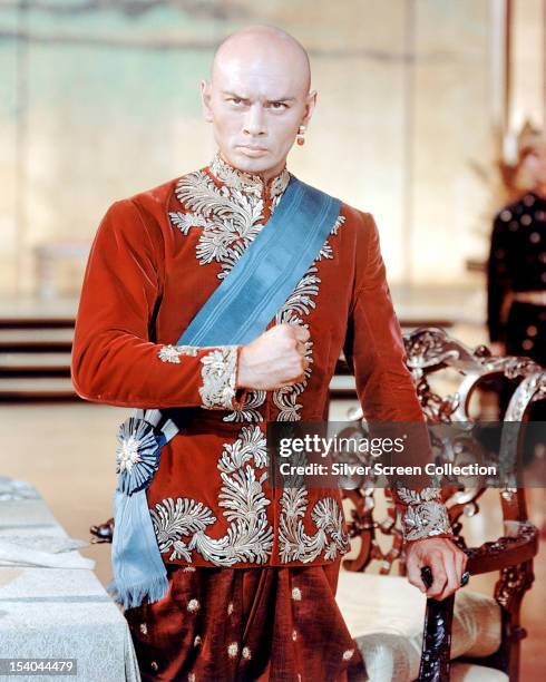 Russian actor Yul Brynner as the King Of Siam in 'The King And I', directed by Walter Lang, 1956.