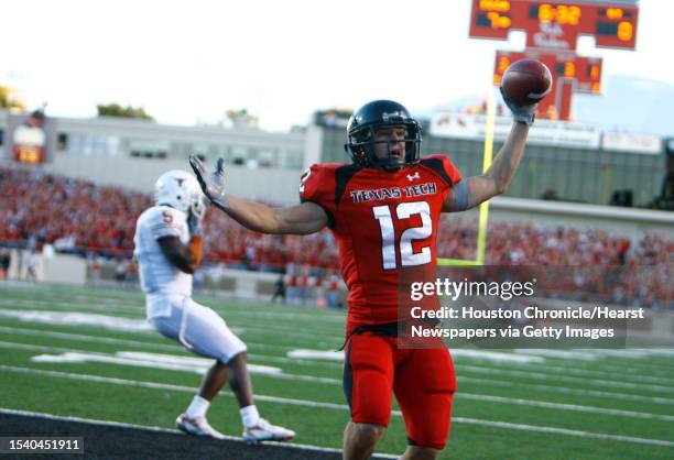 Tech reciever Eric Morris, right, scores Tech's second TD as Texas defender Tarell Brown, watches in the first quarter of his game Saturday, Oct. 28...