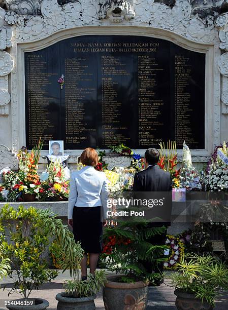 Australian Prime Minister Julia Gillard with Bali governor Made Mangku Pastika visits the 2002 Bali bombings memorial monument on the Indonesian...