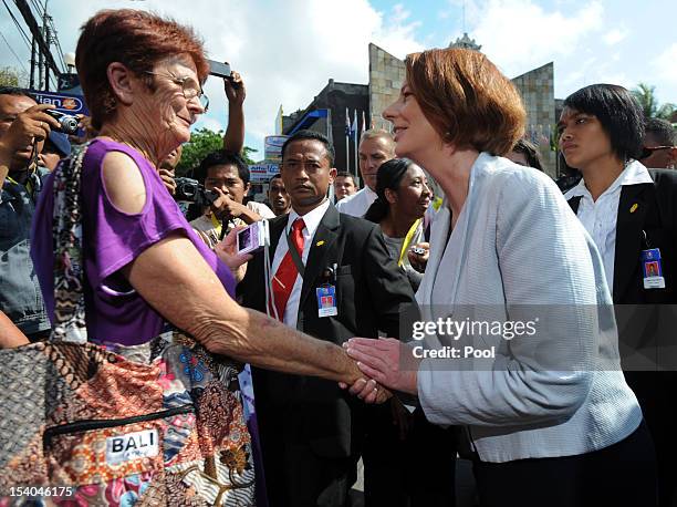 Australian Prime Minister Julia Gillard meets with Australian citizens as she visits the 2002 Bali bombings memorial monument on the Indonesian...