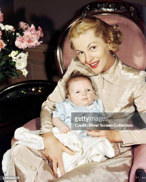 British American actress Joan Fontaine with her baby daughter Deborah Leslie Dozier, 1948.