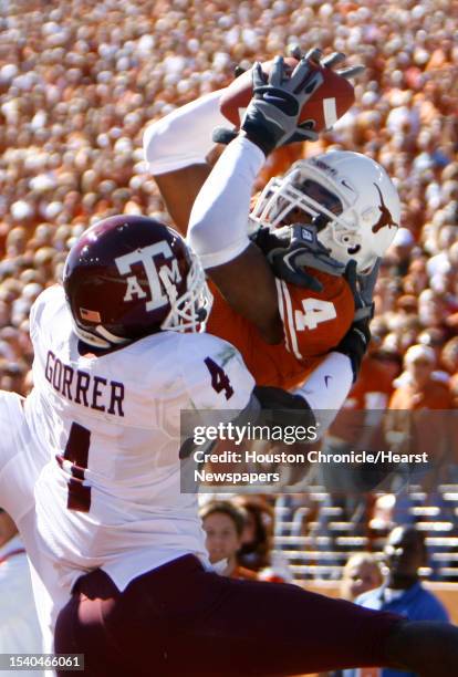 Texas receiver Limas Sweed, top, pulls in the ball as Texas A&M's Danny Gorrer defends in the second quarter of his game Saturday, Nov. 24 at Darrell...