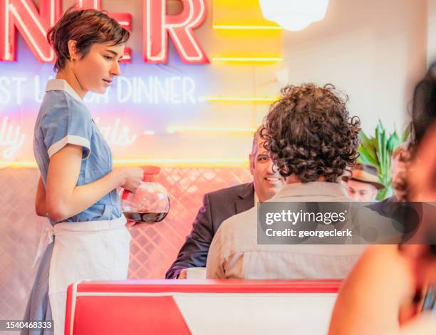 diner waitress serving coffee refills - overworked waitress stock pictures, royalty-free photos & images