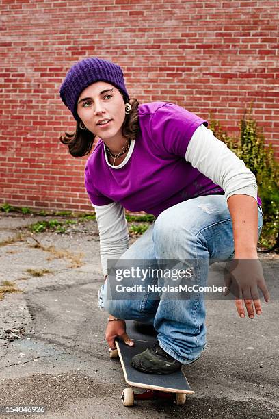 skater girl on her skateboard - toque stock pictures, royalty-free photos & images