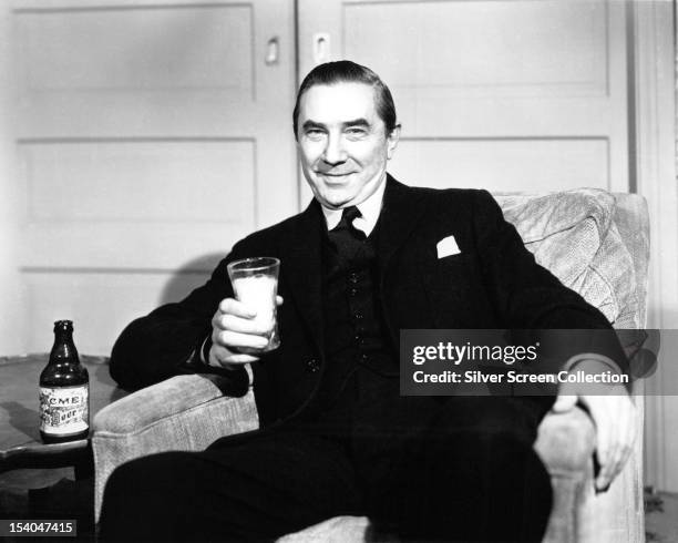 Hungarian actor Bela Lugosi drinking a glass of beer, circa 1940.