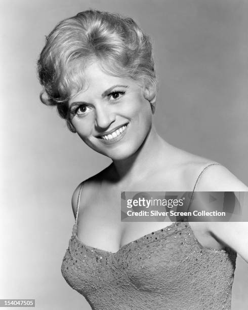 American actress Judy Holliday as she appears in 'Bells Are Ringing, 'directed by Vincente Minnelli, 1960.
